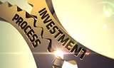 Golden Metallic Cogwheels with Investment Process Concept.
