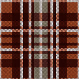 Seamless pattern as a knitted fabric in brown and grey colors