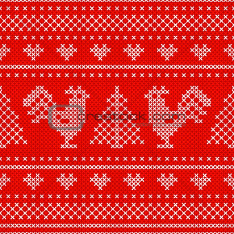 Holiday seamless pattern with cross stitch embroidered roosters
