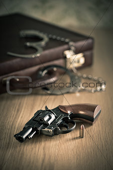 Handcuffs and revolver
