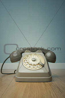 Gray vintage phone on the floor