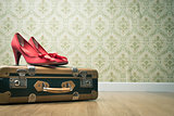 Vintage suitcase and red shoes