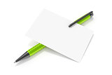 a blank business card and a green ball pen