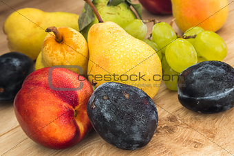assorted bio summer fruits on the wooden table