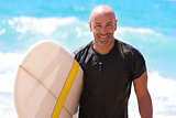 Handsome man with surfboard