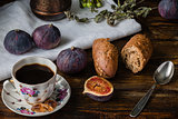 Cup of coffee with fresh bread and some figs