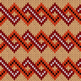 Knitting seamless zigzag pattern in various warm colors