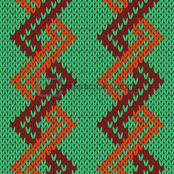 Knitting seamless zigzag pattern in green, orange and brown