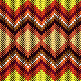 Knitting seamless zigzag pattern in warm hues