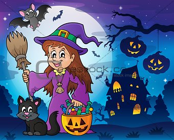 Cute witch and cat in Halloween scenery