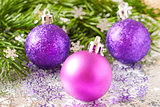 fir tree branch and Christmas toys bauble with confetti