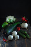 Fresh vegetables , cauliflower and vegetable marrow of zucchini a low key in style  rustic