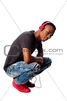 Handsome teenager listening to music