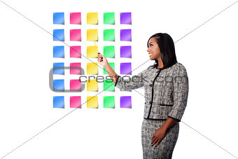 Happy business woman presenting sticky notes
