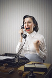 Young Business woman shouting into telephone
