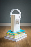 Book with white headphones