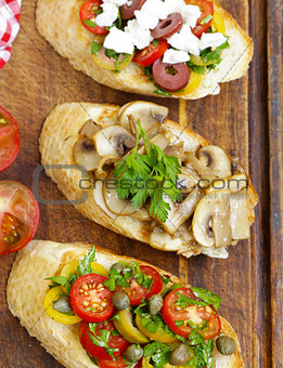 Italian appetizer bruschetta with different toppings