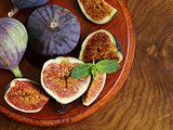 Natural ripe figs on a wooden board