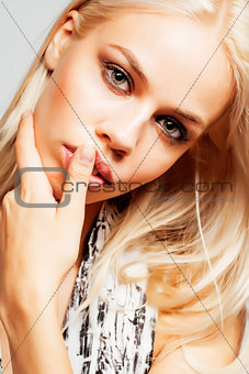 young pretty woman with blond hair on white background, sensual makeup, fashion look