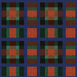 Knitting seamless pattern in red, green, blue and brown hues