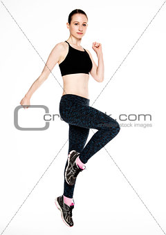 Young fitness girl jumping exercise in gym