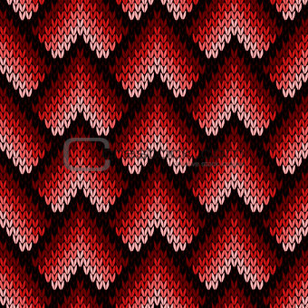 Abstract ornate knitting seamless pattern in red hues