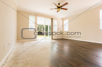 Room with Gradation from Cement to Hardwood Flooring