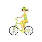 Woman Riding A Bicycle In Helmet