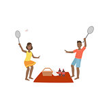 Couple Playing Badminton On Picnic