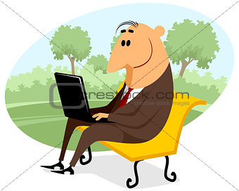 Businessman with a laptop on the bench