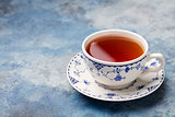 Cup of tea on a blue stone background. Copy space