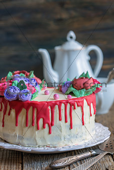 Cake with flowers of cream for coffee.