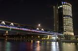 Moscow business center and bridge over river, night scene