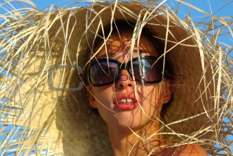 young girl in cane hat