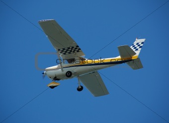 Light Cessna airplane in flight