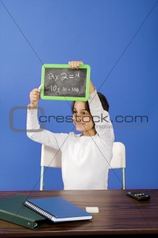 little girl showing chalkboard