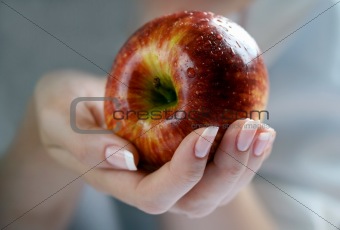 Apple in a female hand