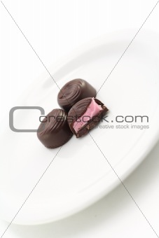 half eaten chocolate on a plate 2