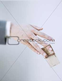 hand and mousetrap
