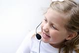 Young girl wearing a telephone headset