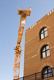 Construction Crane next to a Building
