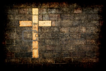 cross of christ built into a brick wall