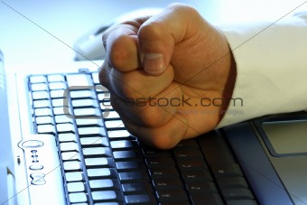 Fist on laptop