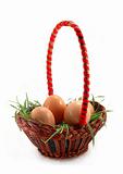 Easter basket with grass and white eggs
