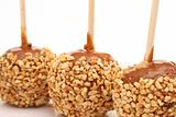 shot of 3 caramel apples w/peanuts of white