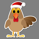 Rooster in Santa hat isolated on grey background.