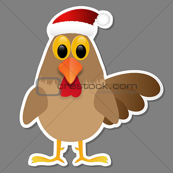 Rooster in Santa hat isolated on grey background.