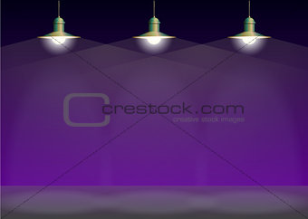 Ancient three bronze lamp hanging. Big and empty space illuminated on the purple wall.