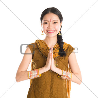 Woman in Punjabi dress greeting.