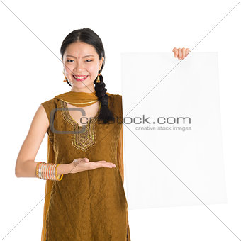 Punjabi female holding blank white paper card.